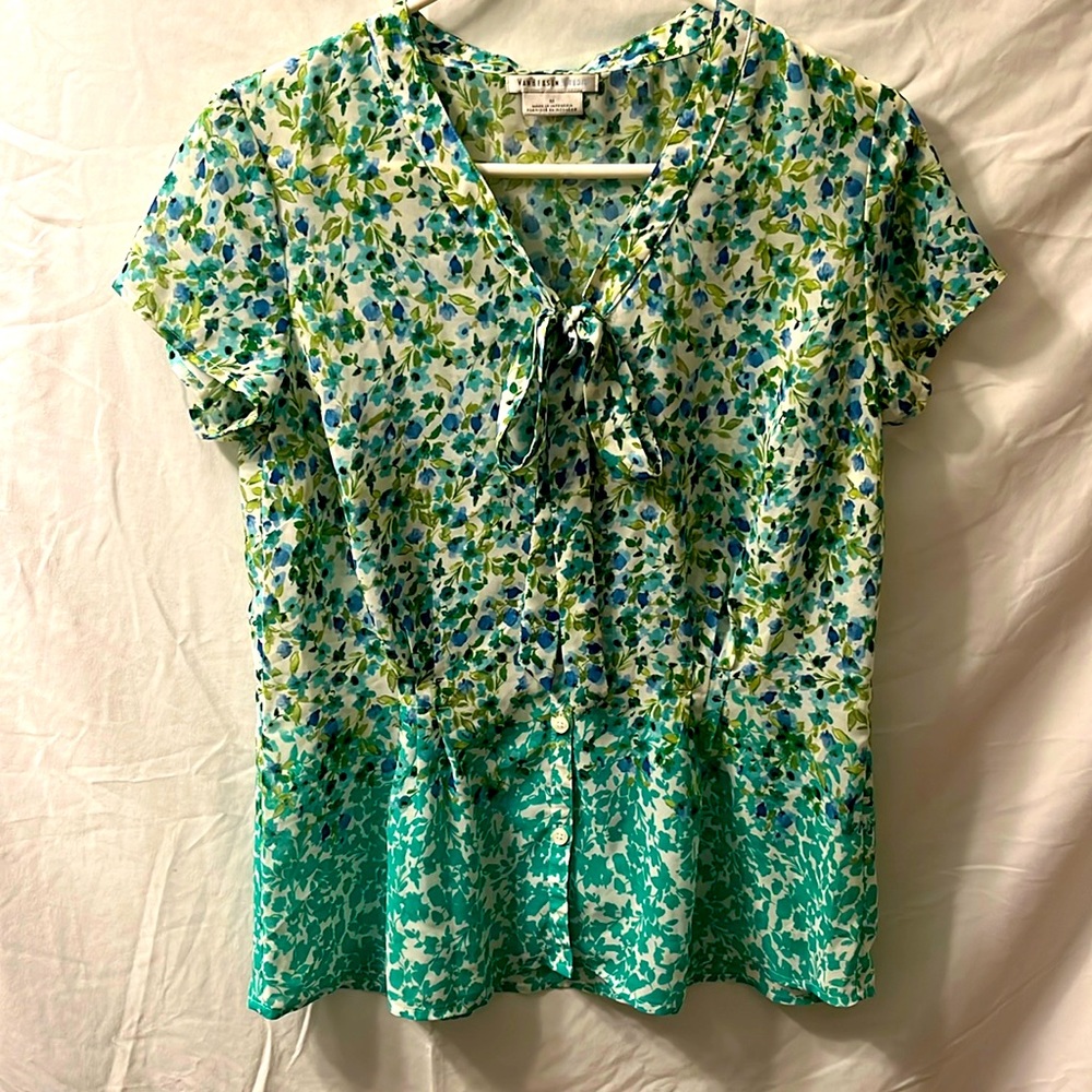 This is a blue, green and white Van Heusen Studio size medium blouse.